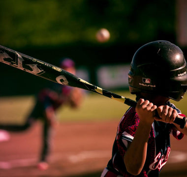 kid at bat practicing good hitting rhythm