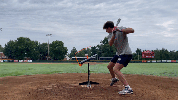 video of baseball player hitting balls with the swing path trainer